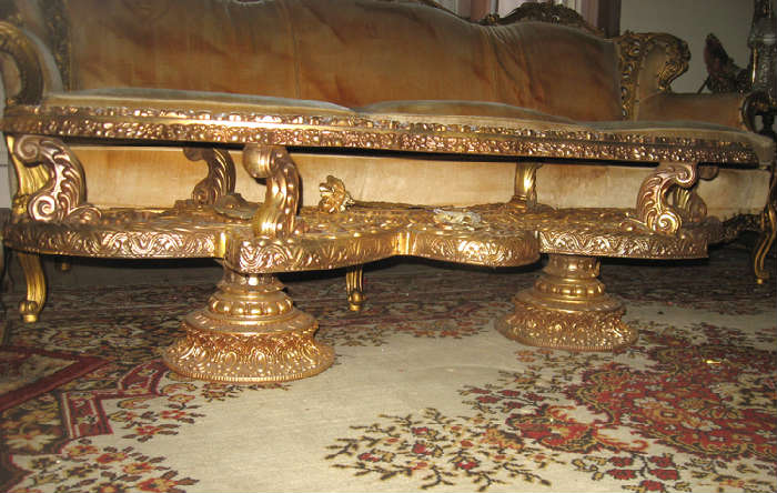 Close up of legs, underneath view of ornate coffee table
