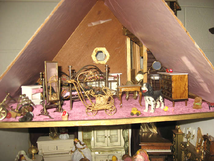 Three levels of dollhouse furniture