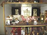 Three levels of dollhouse furniture