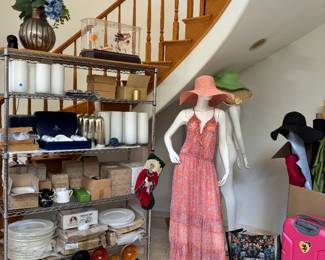 Fashionista event planner vases, clothes, rolls of fabric decor