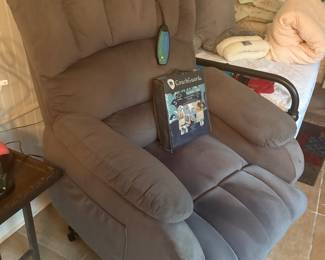 Remote raising recliner with heat and vibration options
