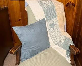 vintagestyle rocker features a light green fabric with a diamond pattern and distinctive wooden go