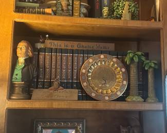 Curated collection, with books, book ends and other decorative items