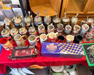Budweiser collector’s steins, car replicas