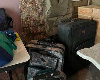 Vintage luggage- hanging bag, suitcases on wheels
