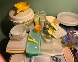 Lots of vintage Tupperware! Full sets of Tupperware measuring cuts, colander, food storage (most with lids), Tupperware trays and measuring spoons