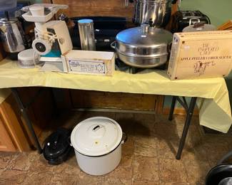 Pampered Chef bread tube and apple peeler (original box), fondue set, coffee percolator, metal pots with lids and much more!