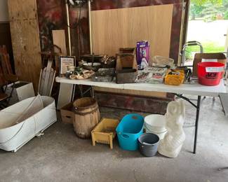 Woven wicker basinet, wooden barrel, plastic mermaid, Oreck vacuum bags, wrenches, sockets, misc tools and much more!