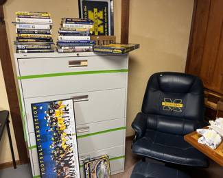 University of Michigan leather chair, U of M books, Umich posters, signs