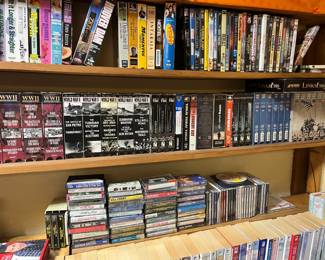 VHS tapes, WW2 documentaries, cassette tapes, CDs, Debbie Macomber books