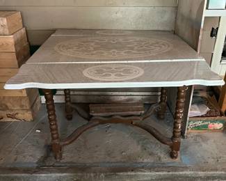 Vintage wood table with enamel top- sides fold up. Needs repairs.