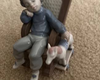 096 Lladr Boy Sleeping in Rocking Chair Figurine