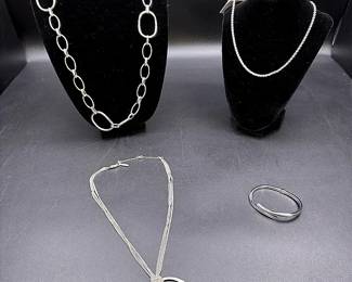 Silver-toned Necklaces And A Hinged Bracelet