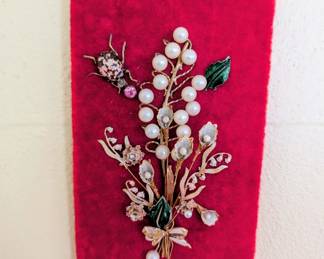 Tiny vintage jewelry art on velvet
