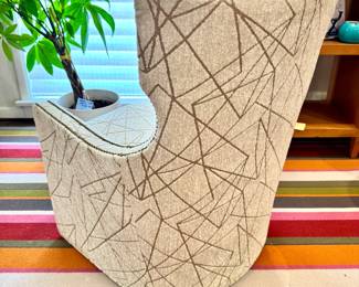 Back View: Expressions stylized wing-backed profile swivel chair- upholstered in contemporary geometric pattern- 28.5x26.5x38- $650