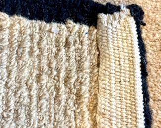 Close up: Himalayan wool- lama Tufenkian rug in black and beige motif- 9'x12'- $3500