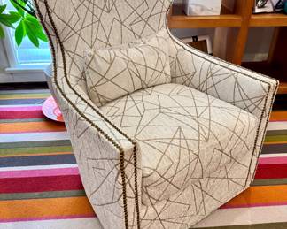 Expressions stylized wing-backed profile swivel chair- upholstered in contemporary geometric pattern- 28.5x26.5x38- $650