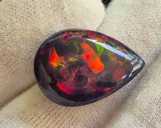 8+ Carat Natural Welo Black Opal Pear Cabochon