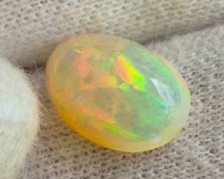 2.81 Carat Natural Welo Opal Oval Cabochon