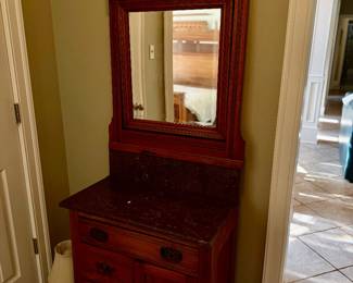 Dresser—part of the antique bedroom set—has marble top