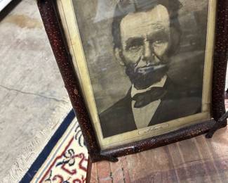 Abraham Lincoln print in log cabin frame