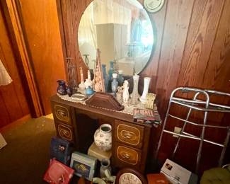 Antique vanity cabinet with round mirror