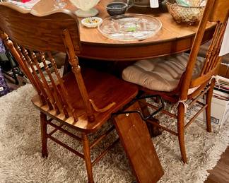 Wood round dining table and six chairs
