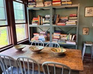 Hundreds of cookbooks in every category, pottery, antique farm table, farm style chairs