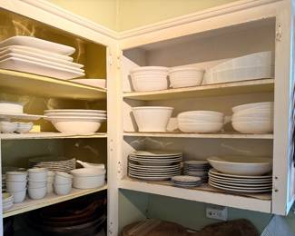 Tons of white dishes; platters, plates, footed bowls, ramekins, chef's knives