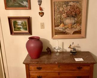 Paintings from local artist, marble topped dresser stamped New Orleans, large Van Briggle vase
