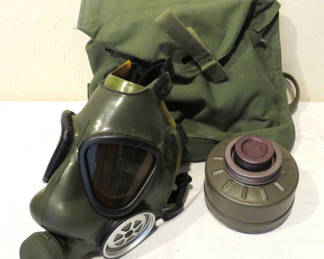 Lot 95: Green military-style gas mask with filter and canvas bag