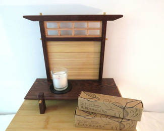 Lot 74: Wooden display shelf with candle and tea infuser boxes