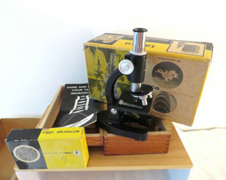 Lot 154: Vintage Tasco microscope with boxes and accessories