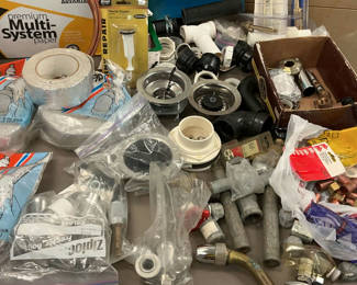 Lot 19: Assorted plumbing fittings, pipes, and fixtures