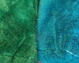 Lot 72: Two fluffy green and teal plush body pillows