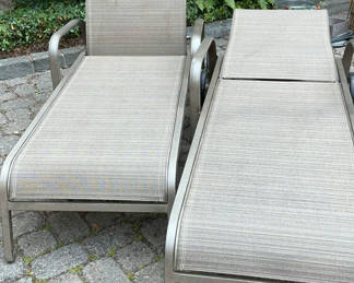 Lot 9: Pair of Sunbrella sling outdoor lounge chairs