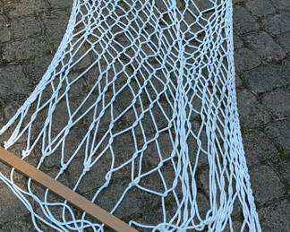 Lot 141: White rope hammock with wooden spreader bars