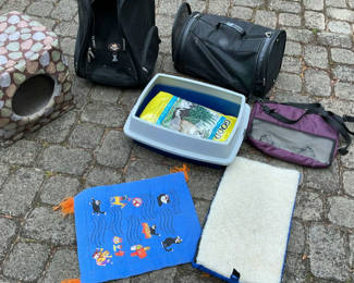 Lot 53: Cat care items bundle: carriers, litter box, litter, cat house, and mats