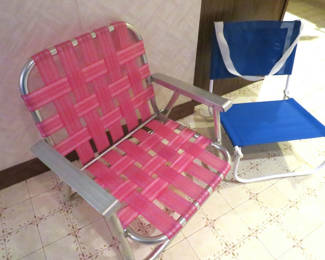 Lot 55: Vintage low webbed pink lawn chair and low canvas chair