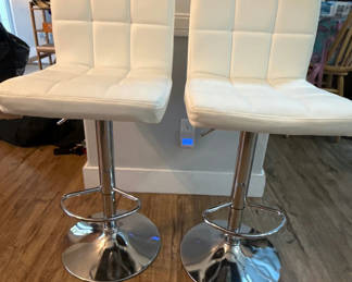Lot 169: Pair of white tufted bar stools