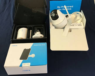 Lot 22: Security camera system with Reolink solar panel and Axis dome camera