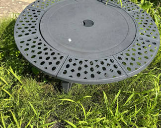 Lot 166: Round gray metal firepit with perforated edge and inner grate