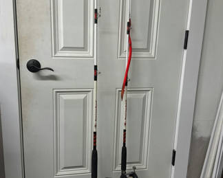 Lot 97: Two fishing rods with spinning reels