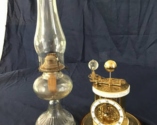 Lot 49: Antique glass oil lamp and ornate brass calendar clock(needs glass dome)