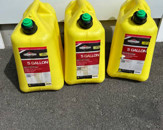 Lot 151: Three yellow 5-gallon diesel fuel containers