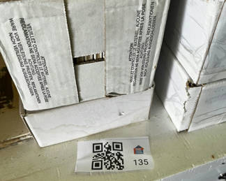 Lot 135: Crystile series decorative tiles in cartons with gray tile slab