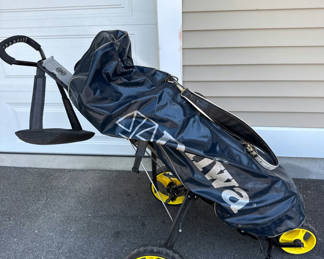 Lot 140: Golf bag with clubs and folding golf cart