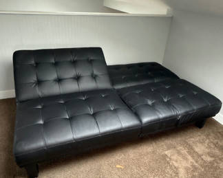 Lot 74: Black tufted leather sofa