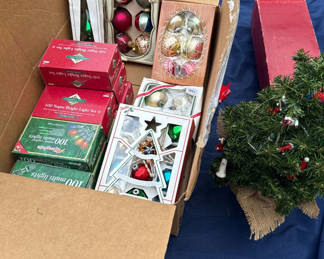 Lot 104: Boxed Christmas ornaments and small artificial tree