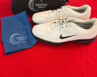 Lot 94: New Nike golf shoes with Akovos Open bag and towel